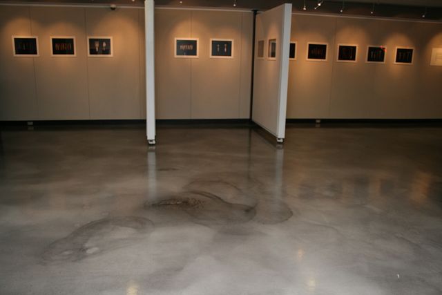 Polished decorative epoxy floor with a marbled finish in an art gallery exhibition space