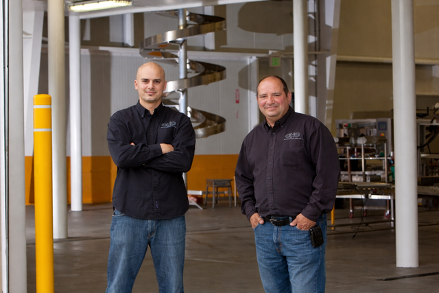 Charles Covollo and a young Vince Covollo on a CNC jobsite